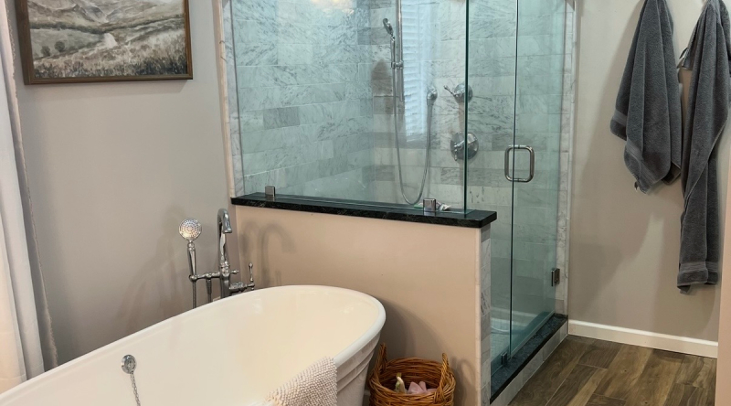 white freestanding tub, marble shower, and white vanity white freestanding tub, marble shower, and white vanity